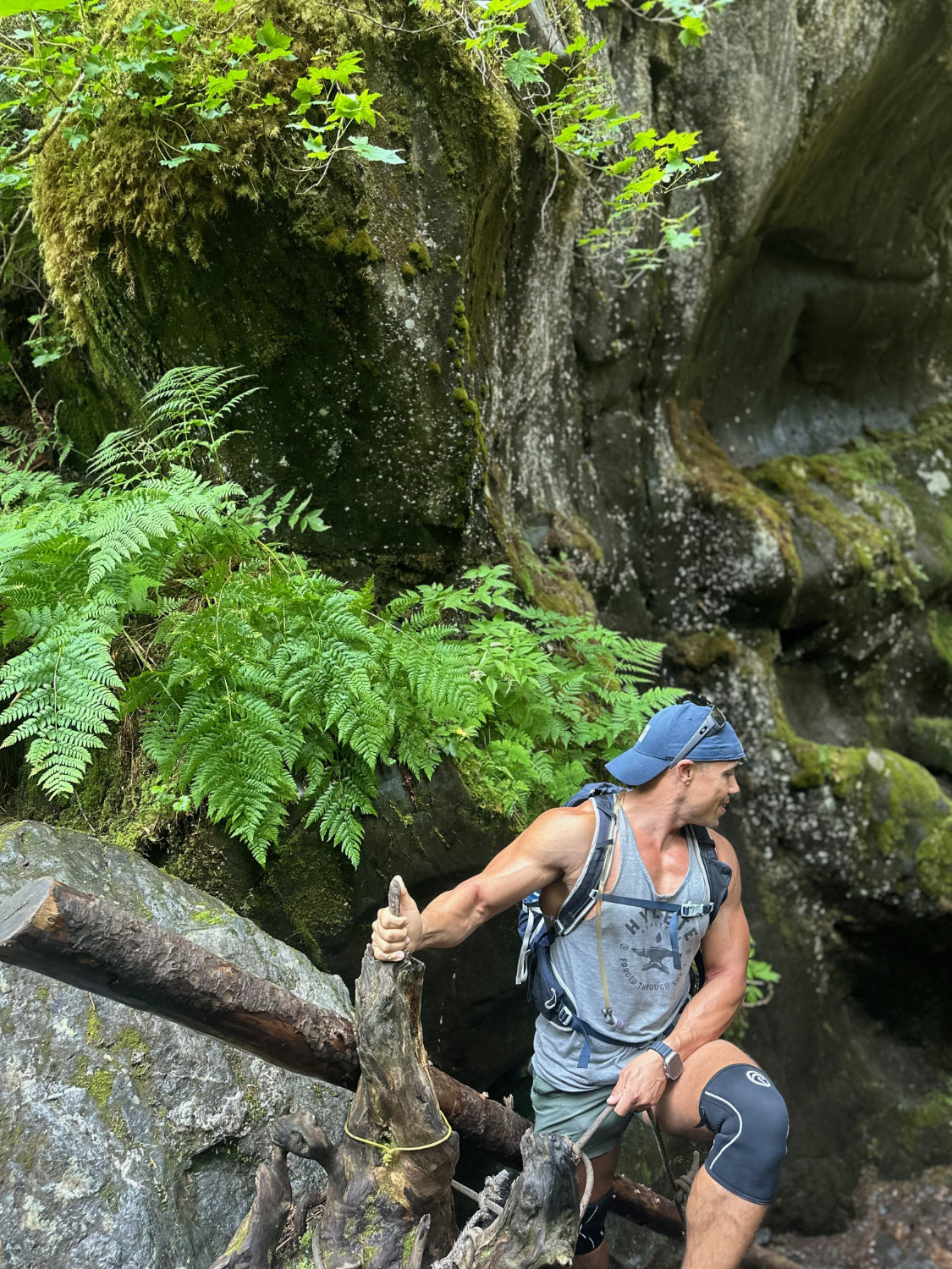 Coop (aka The Productive Adventurer) climbing down one of the ladders on the Chutes and Ladders hike in Girwood Alaska