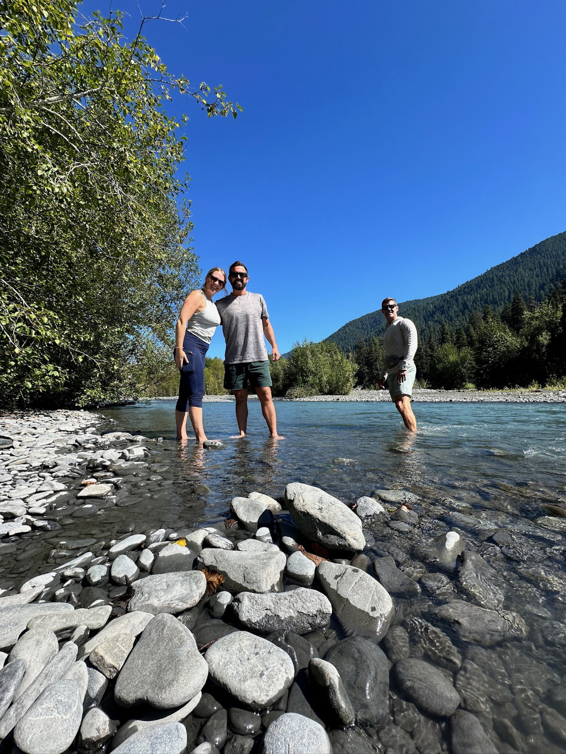 Grant, Michelle and Mark posing in the river after hiking to 5-mile island on the Hoh River Trail.