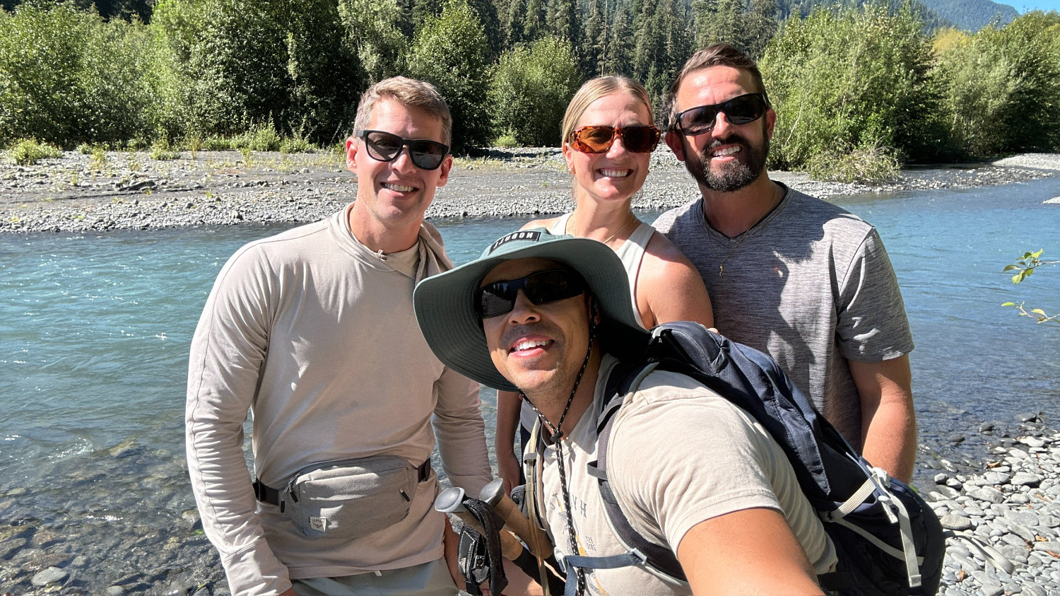 The McCoops and their besties posing at the river after hiking to 5-mile island on the Hoh River Trail.