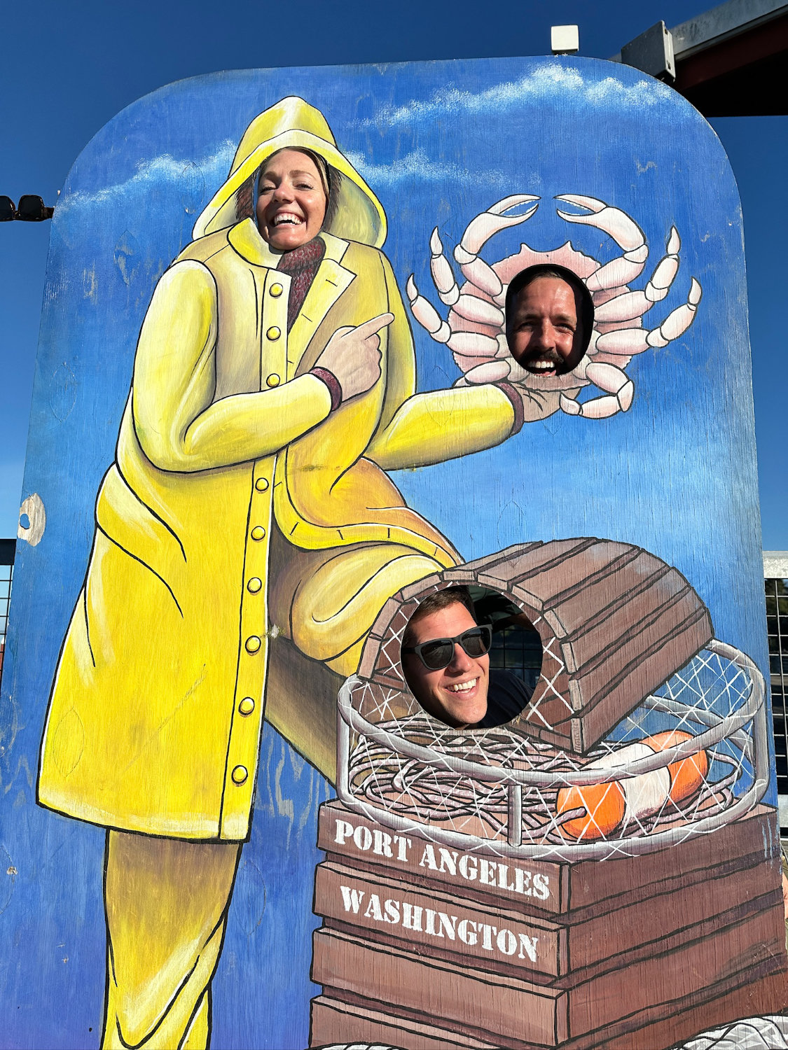 Grant, Michelle, and Mark having fun with the photo-stand-in in Port Angeles, Washington on our way to Olympic National Park.