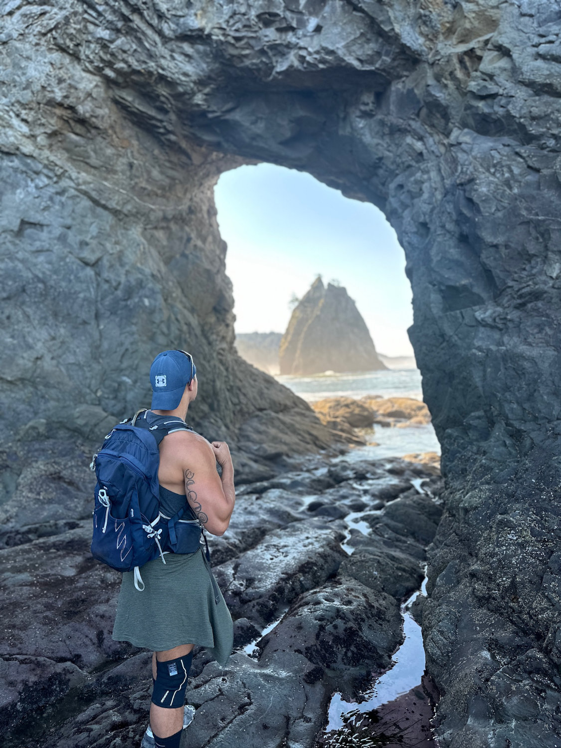 Portrait of Coop at the 'Hole in the Wall' at Rialto Beach in Olympic National Park.