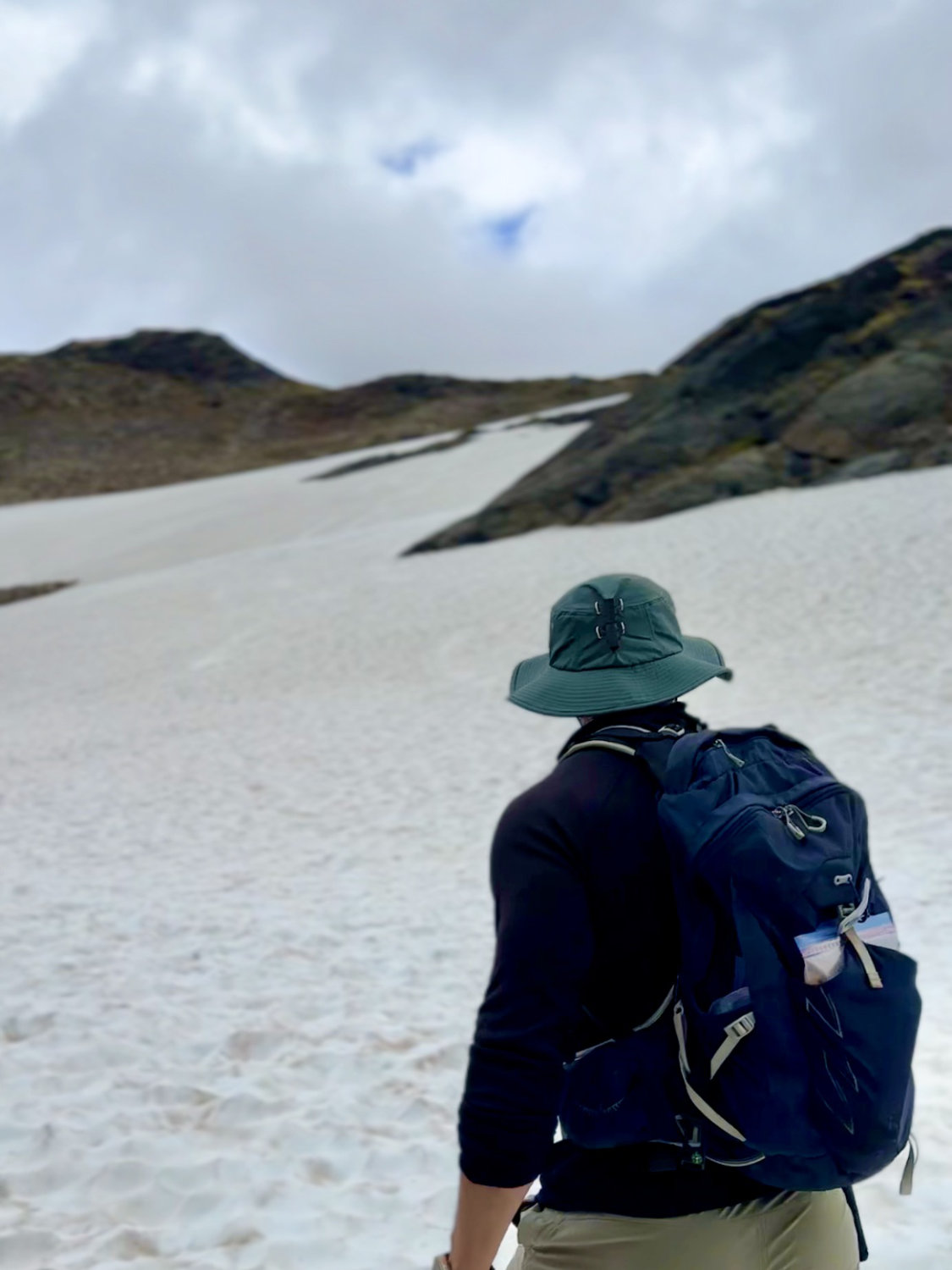 Coop (aka The Productive Adventurer) at the base of Raven Glacier on the Crow Pass trail in Alaska