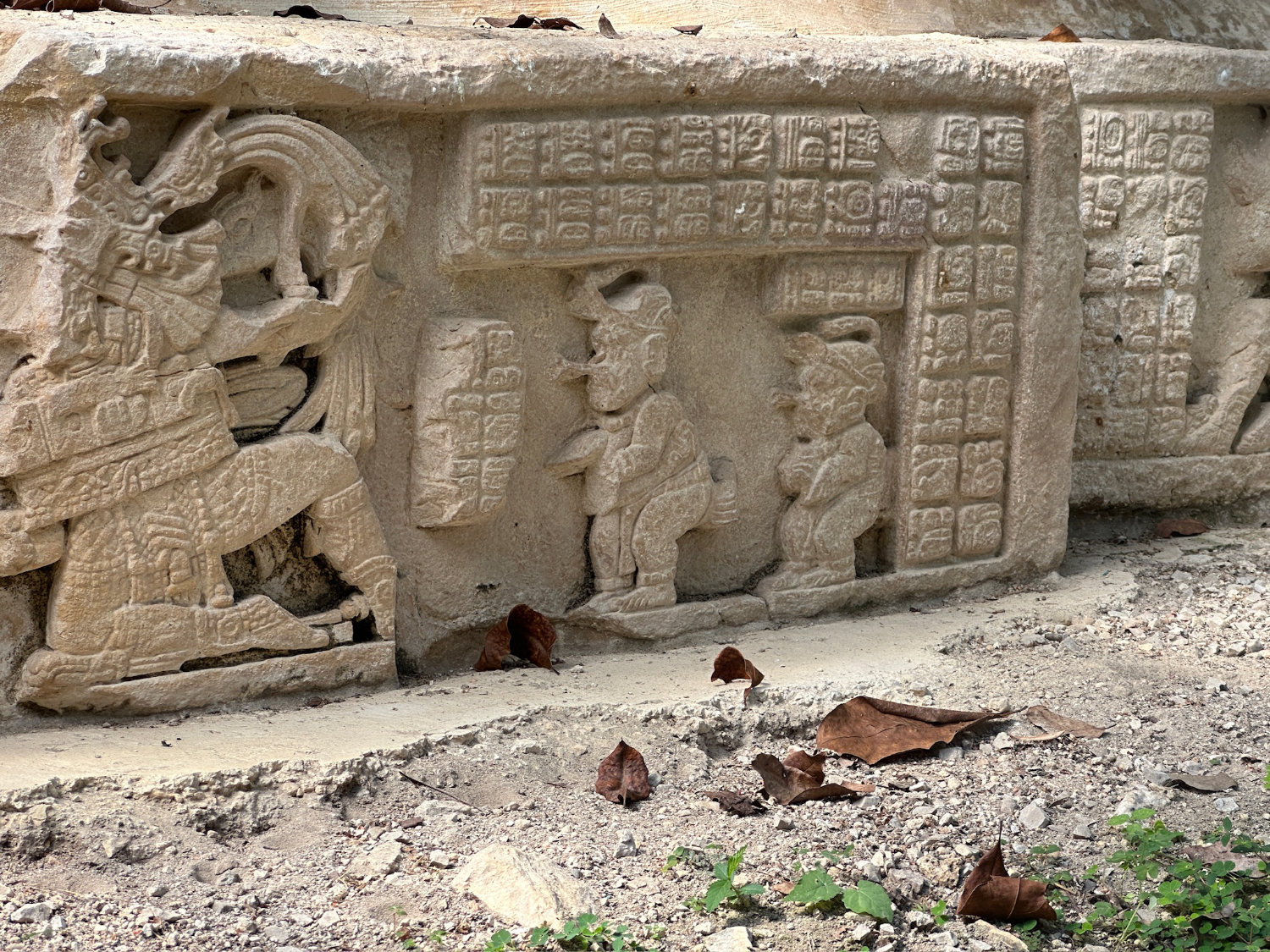 Carving showing aluxes watching ball game