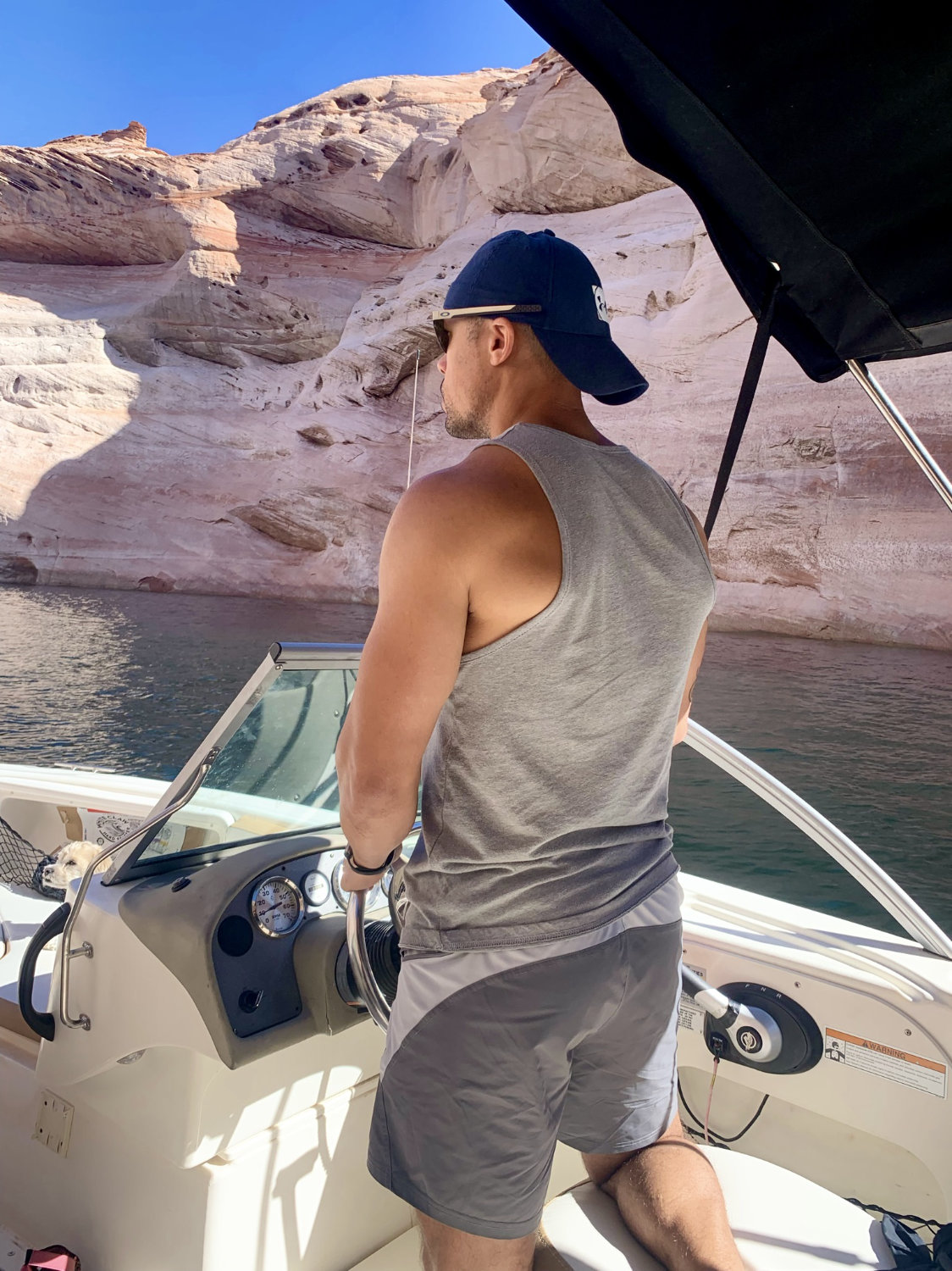 Cooper driving the boat in Lake Powell near Page Arizona